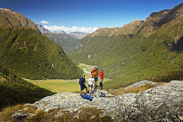 Hikers take in the view down the Routeburn Valley